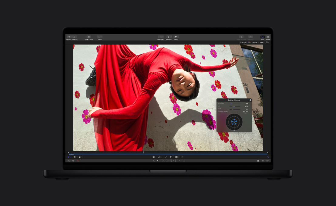 MacBook Pro de 16 pulgadas, mujer con vestido rojo, demostración de cómo se agregan flores al fondo