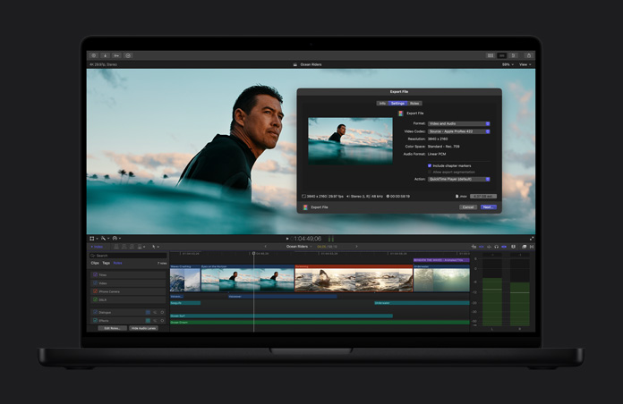 MacBook Pro de 16 pulgadas que muestra la imagen de un surfista en el mar a la espera de una ola, ventana de exportación de archivos abierta, línea de tiempo de un clip de video en la parte inferior de la pantalla