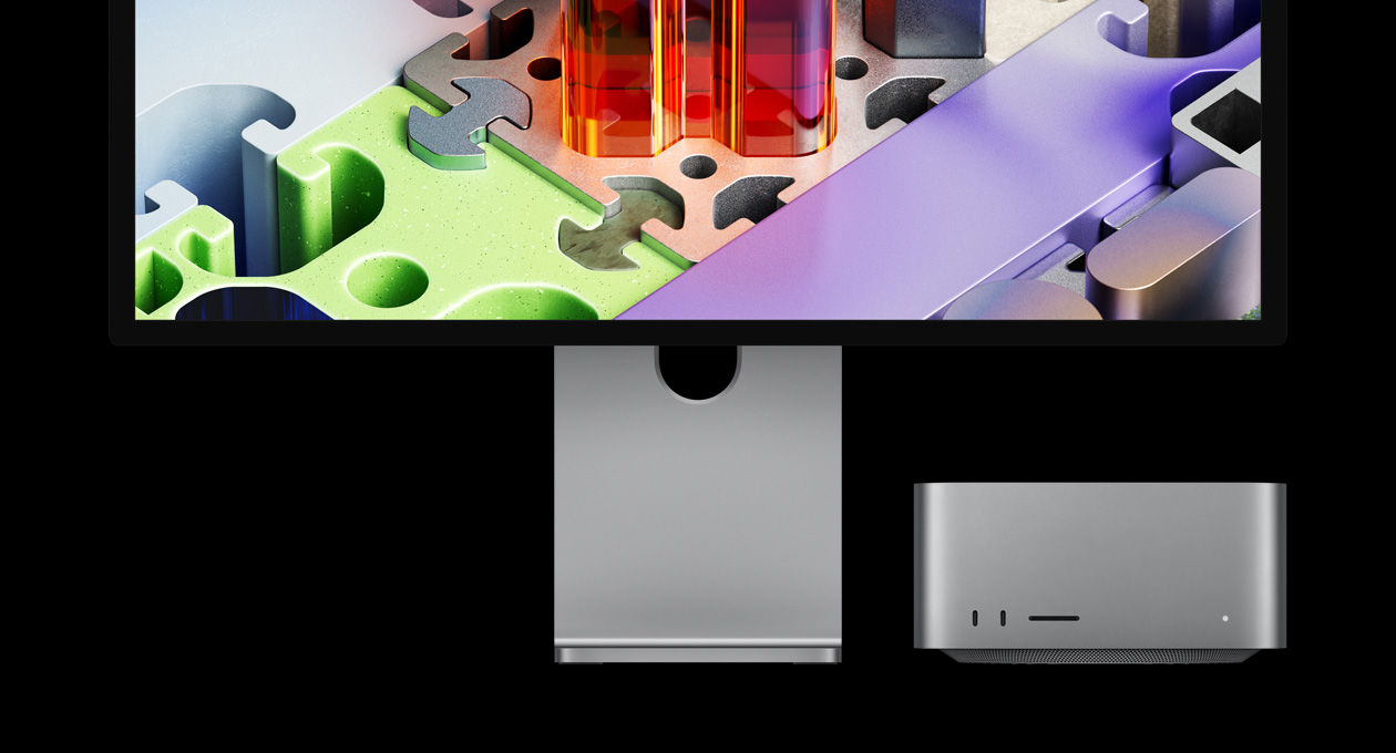 Mac Studio con un monitor Studio Display XDR, el dispositivo está debajo de la pantalla: el monitor Studio Display XDR tiene un fondo de pantalla tridimensional similar a un rompecabezas